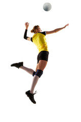 Fototapeta na wymiar Full-length dynamic image of young woman, volleyball player in motion, practicing, hitting ball in jump isolated over white background. Concept of sport, competition, active, healthy lifestyle, hobby