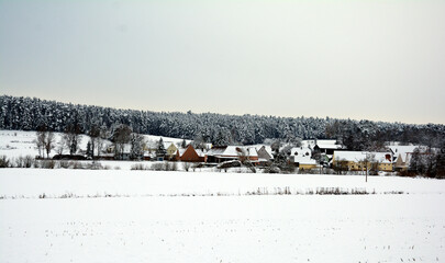 Panorama of small German village covered with snow
