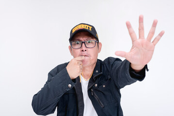 Security personnel blowing his whistle while commanding someone to stop and freeze. Gesturing with palm to halt, conveying a restricted area. Isolated on a white background.