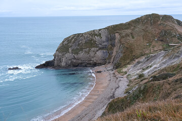 Man O'War Beach and Durdle Door on Jurassic Coast, Dorset, England. Scenic bay surrounded by Jurassic Coast rocks. Winter or autumn days. beautiful landscape and seascape view. English Channel. UK