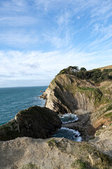 Lulworth Cove cliffs view on a way to Durdle Door. The Jurassic Coast is World Heritage Site on the English Channel coast of southern England. Dorset, UK. Jurassic coast view in Dorset, UK. Stair Hole