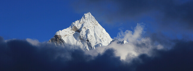 Famous Mount Ama Dablam reaching out of clouds, Nepal.
