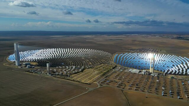 Aerial view of the Solar Power Towers PS10 and PS20 in Sanl&uacute;car la Mayor, Seville. Spain's stunning solar energy plant.  Concentrated solar power plant. Renewable energy. Green energy.