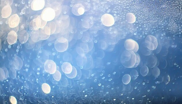 light blue background bokeh drops glass blurred
