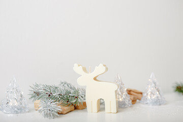 Christmas winter decoration on a white background. Toy candle car with Christmas tree on top, deer,...