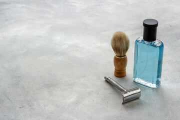 Men perfume and shaving tools. Male accessories close up