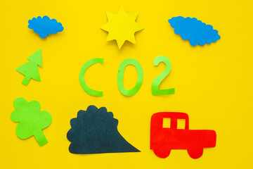 CO2 carbone dioxide concept with kids paper car and traffic fumes