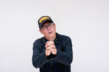 A calm and collected security guard desperately pleading to someone to listen, hands clasped together. Asking forgiveness and mercy. Isolated on a white background.