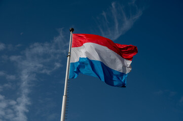 Views of flag of Luxembourg country and blue sky  in Luxembourg or Luxembourg City capital city and one of de facto capitals of European Union