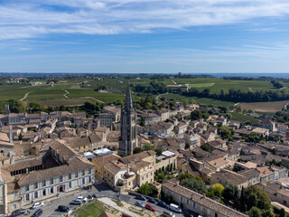 Fototapeta na wymiar Aerial views of green vineyards, old houses and streets of medieval town St. Emilion, production of red Bordeaux wine on cru class vineyards in Saint-Emilion wine making region, France, Bordeaux