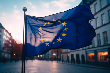 The flag of the European Union against the background of a cozy European city