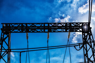 High voltage power line against the blue sky