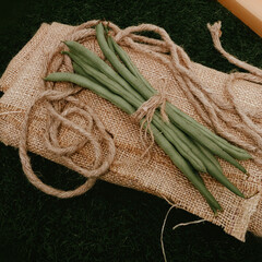 fresh green beans on the jute with rustic photography style