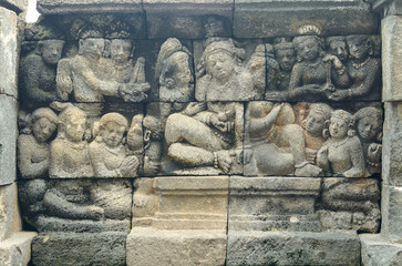 Historical relief sculptures at the Buddhist temple Borobudur in the city of Magelang, Central Java, Indonesia
