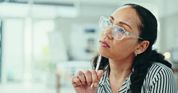 Glasses, thinking and business woman with a pen in office for planning, solution or problem solving. Creative, idea and female designer with why, questions or guess gesture for brainstorming thoughts