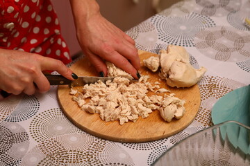 Cutting chicken in the kitchen