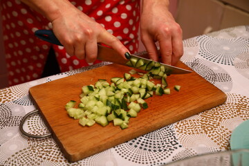 Cucumber cutting on the kitchen