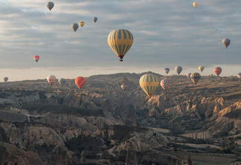rising sun lit the numerous hot-air balloons in the early morning, Cappadocia, Turkey