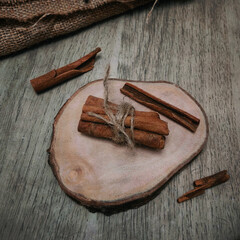 cinnamon sticks on rustic wooden background