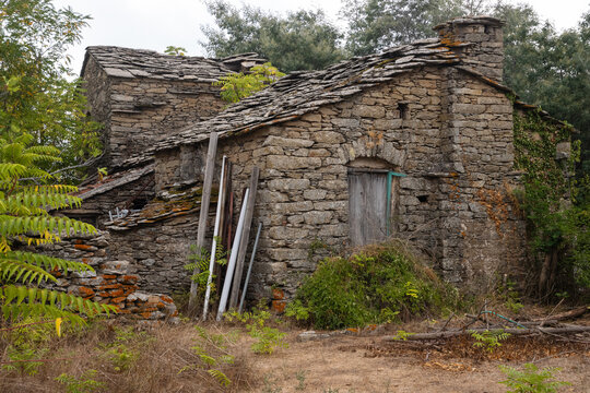 Abandoned old traditional Ikarian stome house with slate roof in the mountain village of Christos Raches.