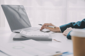 Thinking about how to take the business to technological heights. Cropped shot of an attractive young businesswoman working in her office.