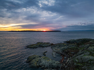 Rocky Shore on Pacific Ocean West Coast. Cloudy Sunrise