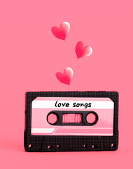 Retro vintage tape cassette with love songs and pink hearts on pink background. Minimal art poster.