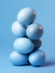 Chicken eggs pyramid, blue colors, copy space