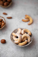 Composition with delicious homemade Christmas cookies. Festive decorated sweets with Christmas decorations. Vanillekipferl are Austrian crescent-shaped biscuits made from almonds and hazelnuts.