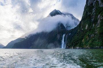 Photograph of Waterfalls from a boat on a misty and rainy day in Milford Sound in Fiordland...