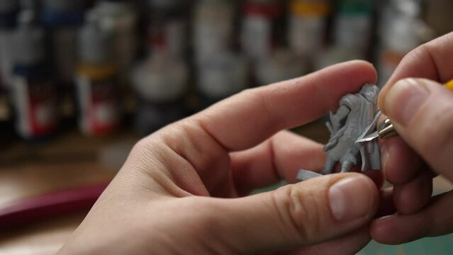 cleaning moldlines with modeling hobby knife, painting minis for rpg game