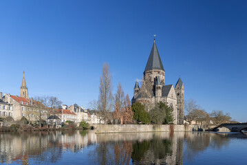 Fototapeta na wymiar Metz, France - January 19th 2019 : View of the Protestant temple of Metz, on the Moselle river, in the historical part of the city.
