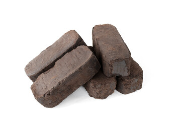 peat fuel briquettes, an alternative type of fuel for heating. Close-up, on isolated white