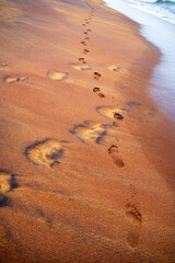 Footprint in orange color sand of beach. Waskaduwa.