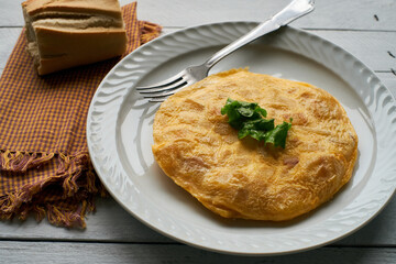 Traditional spanish omelette on wooden table