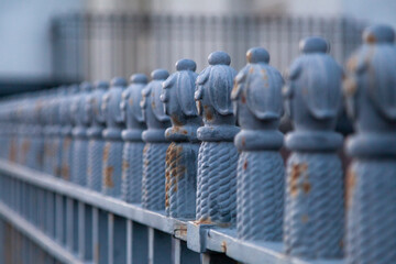 Antique wrought iron fence with shallow depth of field