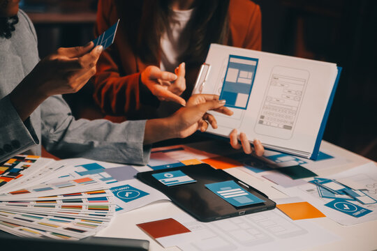 team of UI UX web designer are working together to develop mobile responsive websites. Mobile Mockup