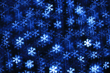 Abstract dark winter background with navy blue and white snowflakes