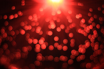 Festive red and black background with boke and yellow light on top
