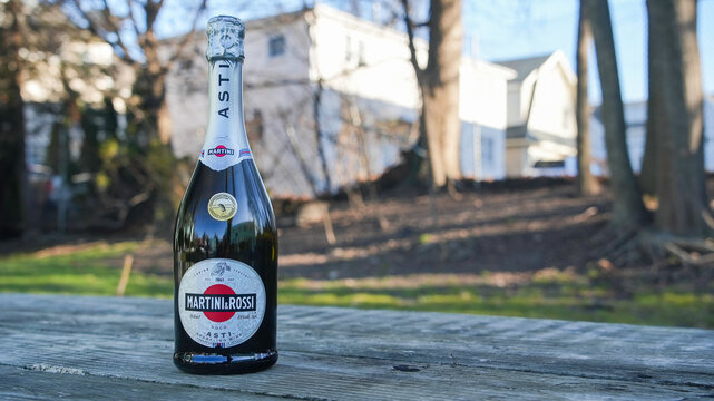 NORWALK, CT, USA- DECEMBER 20, 2023: Martini and Rossi bottle with sparkling wine outside on table
