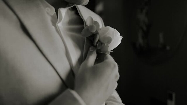 morning of the groom in a beautiful jacket and boutonniere before the wedding ceremony and meeting the bride
