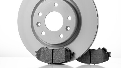 Modern new brake pads for passenger car ventilated disc brakes, brake pads close-up on white...