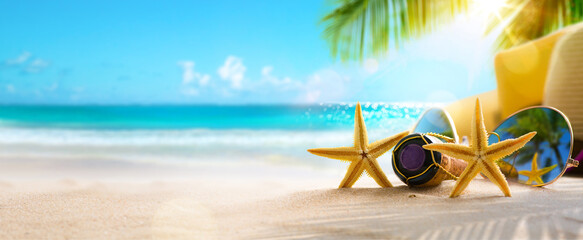 Honeymoon vacation on Sunny Tropical Sandy Beach With Palm Leaves And Paradise Island - obrazy, fototapety, plakaty
