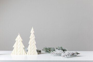 Christmas and New Year composition. Christmas candles, fir tree branches, gifts, pine cones on...