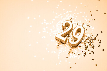 29 years celebration festive background made with golden candle in the form of number Twenty-nine...