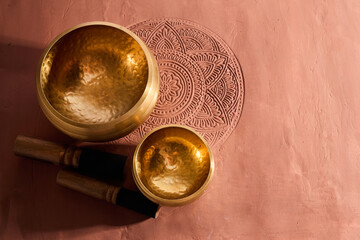 A close up of a tibetan singing bowl or himalayan bowl for therapy, meditation and relaxation. - obrazy, fototapety, plakaty