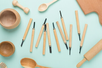 Carpenter tools with wooden objects on color background ,top view