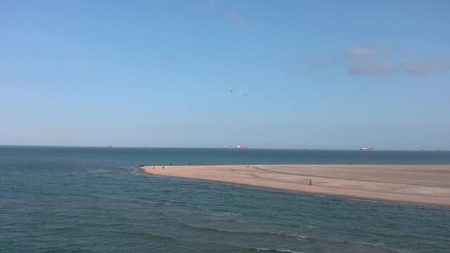 Aerial landscape panorama of Skagen Odde peninsula and Grenen - a meeting point of North and Baltic Sea (Skagerrak and Kattegat). North Jutland, Nordjylland, Denmark
