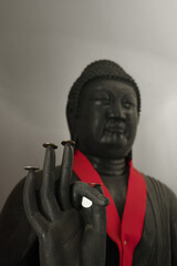Buddha statue with Japanese coin on the finger and hand In post “Vitarka mudra” is also known...