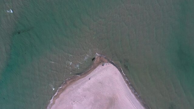 Aerial view directly above the Grenen - a meeting point of North and Baltic Sea (Skagerrak and Kattegat) on Skagen Odde peninsula. North Jutland, Nordjylland, Denmark